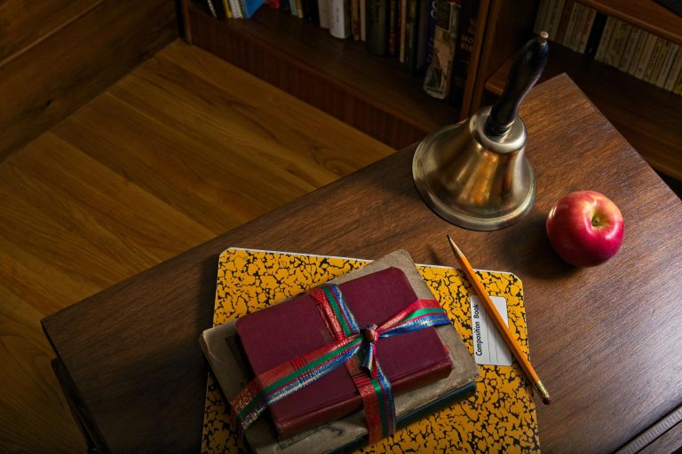 handbell sitting on a school desk